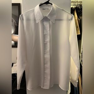 White long sleeve button up shirt with unique designs in the collar